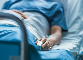 patient sitting in hospital bed