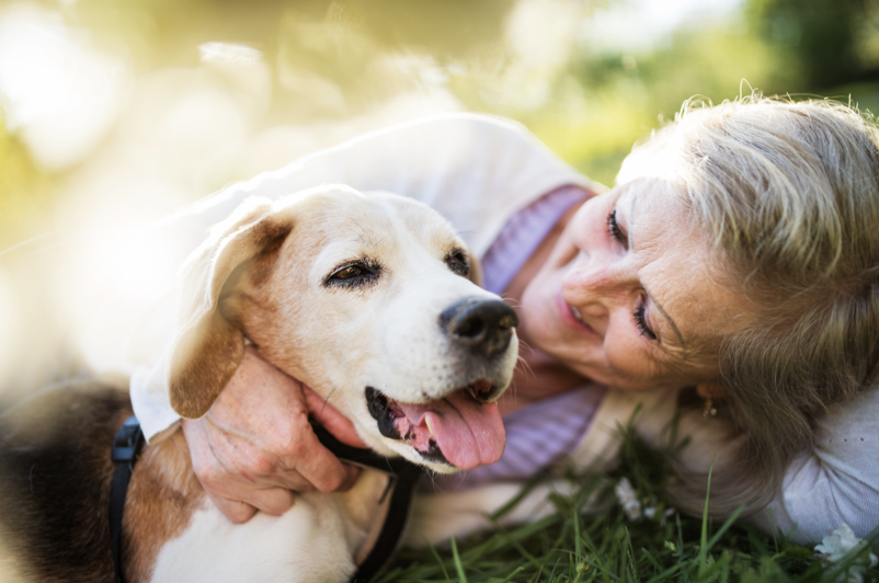 happy-older-woman-with-dog.png